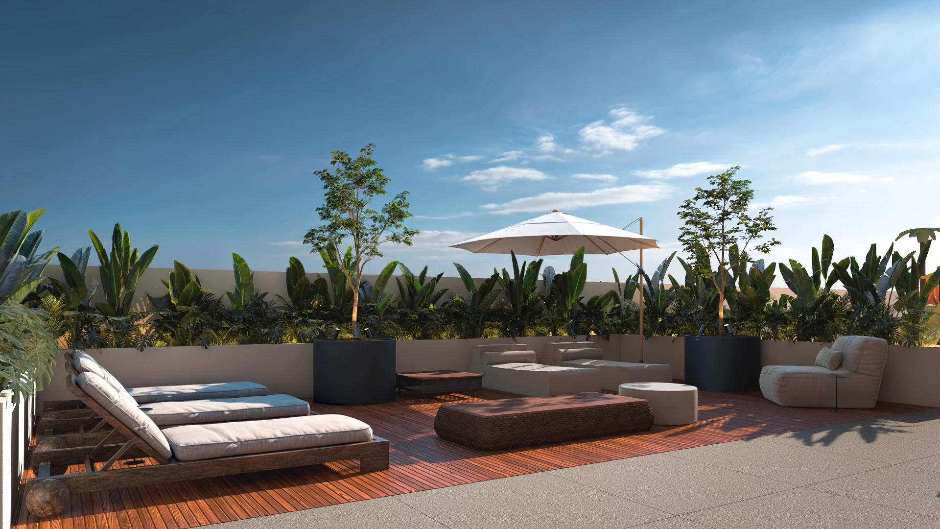 Solário do Baker’s Bay Residence: espreguiçadeiras e ombrelone sobre deck de madeira, cercados de vegetação